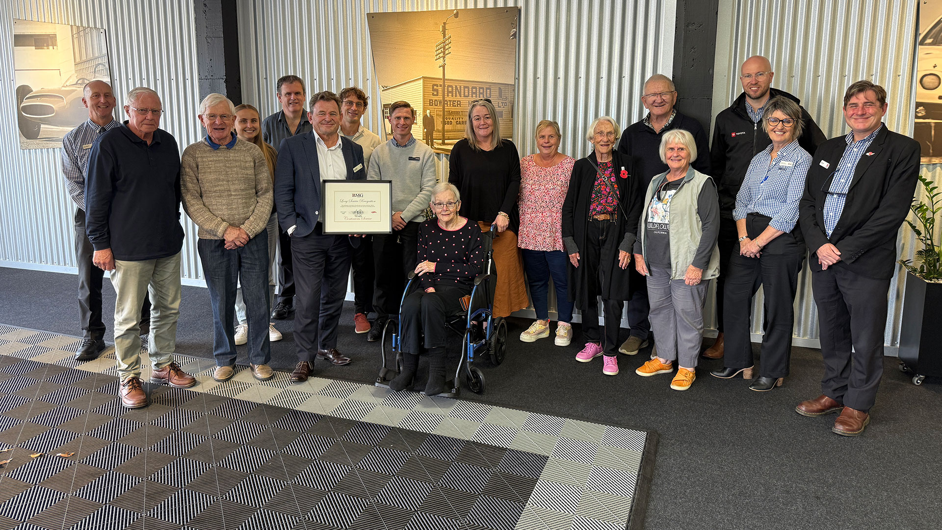 BMG team and Tony with his long service certificate